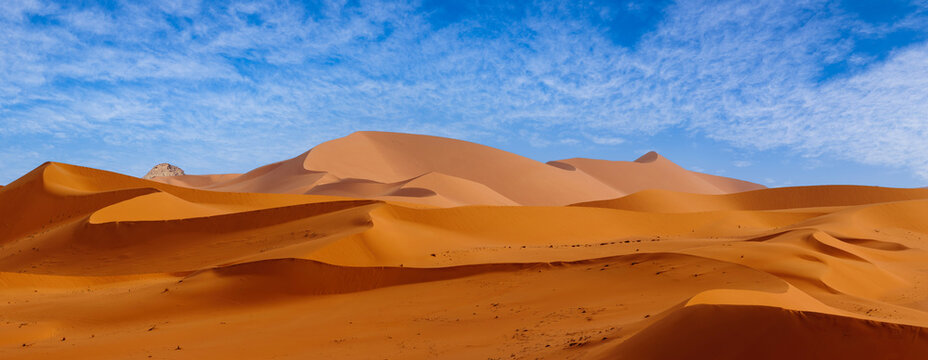 Tadrart Rouge, meaning Red Mountain, a mountain range in southeastern Algeria, part of the Algerian Desert providing massive dunes, rock formations and Martian landscapes