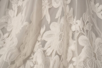 Sheer lace fabric with artistic floral motifs in ivory
