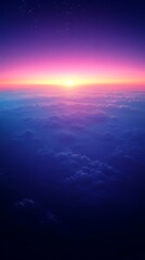 Obraz premium Aerial view of vibrant sunset above clouds.