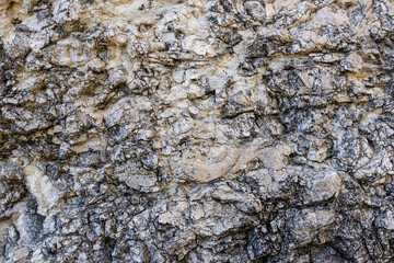 the structure of the surface of natural stone in the canyon of mountain rocks and other stone surfaces in mountainous areas