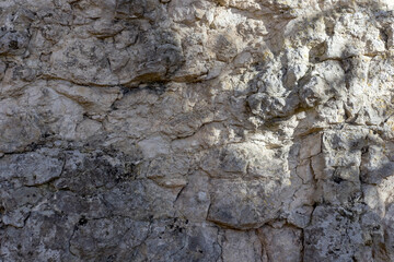 the structure of the surface of natural stone in the canyon of mountain rocks and other stone surfaces in mountainous areas