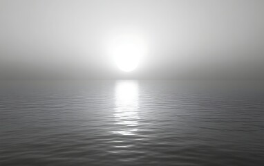 Monochromatic ocean sunset with sun reflection.