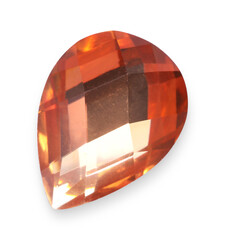 One orange shiny gemstone isolated on white
