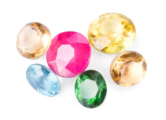 Different colorful shiny gemstones isolated on white