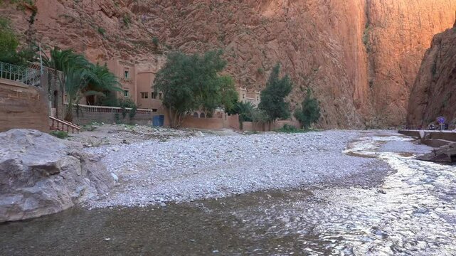 Africa, Tinghir, Morocco,   Todra Gorge of Atlas mountains, People tourists walking between rocky high walls of the canyon ,
Todra and Dades Valley tourist destination sightseeing attraction