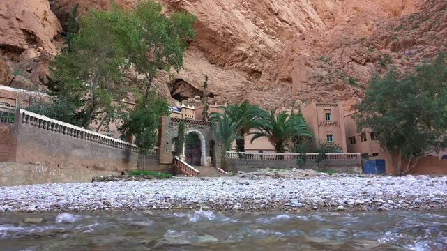 Africa, Tinghir, Morocco,   Todra Gorge of Atlas mountains, People tourists walking between rocky high walls of the canyon ,
Todra and Dades Valley tourist destination sightseeing attraction