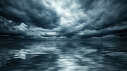 Fototapeta premium stormy sky looms over tranquil lake, creating dramatic reflection on water surface. dark clouds evoke sense of calm amidst brewing tempest