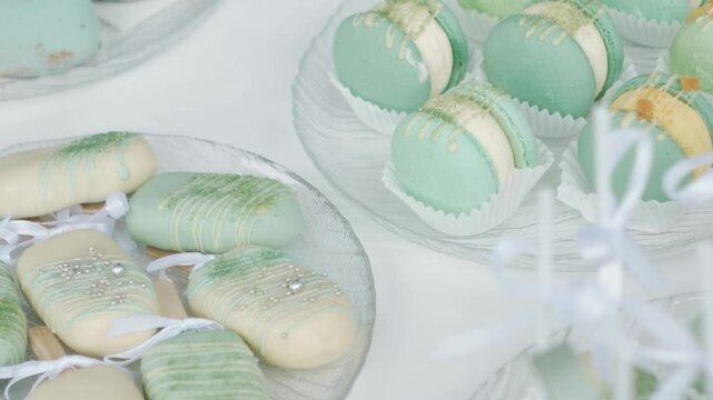 delicious white and blue cakes and sweet desserts macaroons lie on the buffet. Banquet table at the event and holiday. Confectionery sweets close-up