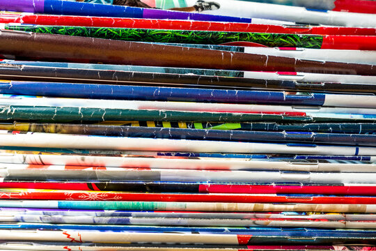 Many newspapers and colorful magazines spines