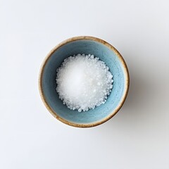 Close up View of Artisanal Salt in a Soft Blue Ceramic Bowl on a Clean White Background