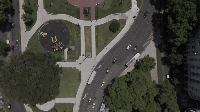 Drone flies with camera down over Plaza Mariano Moreno, Plaza del Congreso and the National Congress in Buenos Aires, Argentina