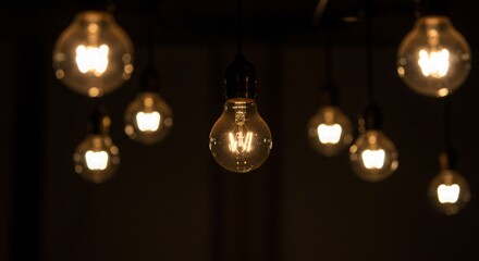 A light bulb glowing dimly, surrounded by brighter but distorted images of itself.