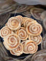 Brown Sugar Pinwheel Cookies inside a Glass Cookie Jar.