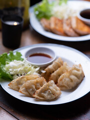 Japanese fried gyoza dumplings with soy sauce