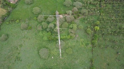 Wind Measurements tower in tropical country seen from drone