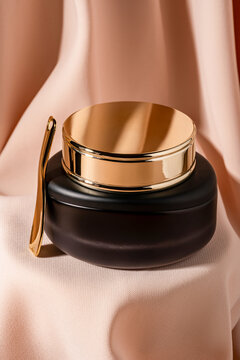 Elegant luxury cosmetic jar resting on soft fabric drapery