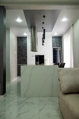 Kitchen in the house. Work surface and refrigerator.