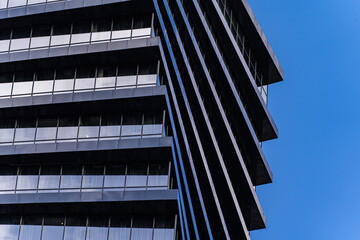 Close-up view of a modern skyscraper's geometric facade
