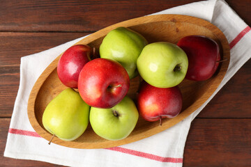 Fresh red and green apples on wooden table, top view