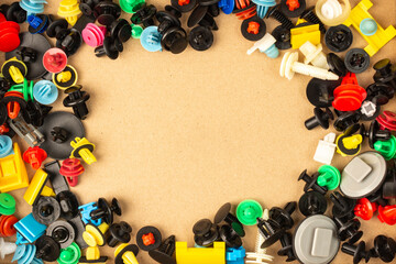 Close-up of plastic colored clips for car.Abstract background. Panel plastic rivets, Auto plastic clips.