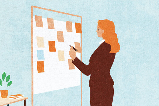 Woman brainstorming business ideas using a message board