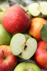 Pile of different whole ripe apples, closeup