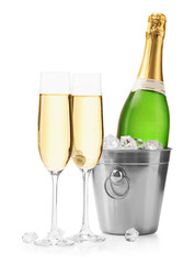 Champagne and bucket with ice isolated on white
