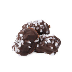 Tasty chocolate candies with salt isolated on white