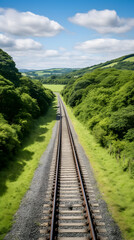 Fototapeta premium Nostalgic Scene of Vintage Steam Locomotive on Gwili Railway in Lush Green South Wales Countryside