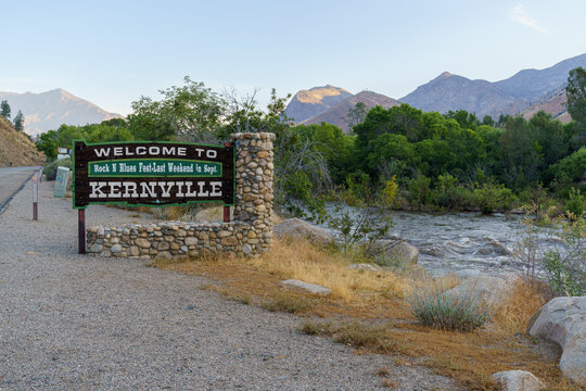 Welcome to Kernville California sign by Kern River with mountains