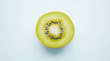 Kiwi fruit cut in half showing seeds and flesh on white background