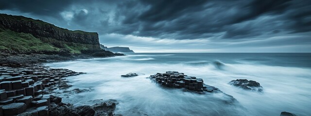 A dramatic capture of the rugged coastline and sea stacks of Acadia National Park, USA, under a stormy sky with crashing waves and dramatic light