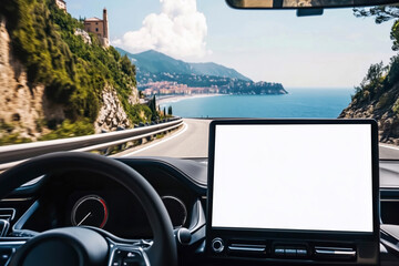 A white blank mock-up touchscreen in a modern car with a minimalist interior driving on the road with a coast in the background
