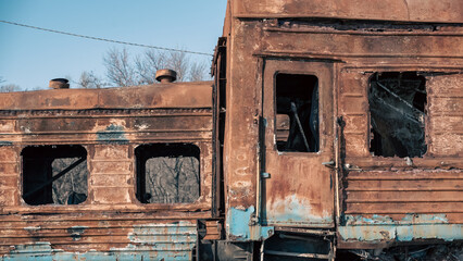 destroyed and burned train carriages on the railway in the city in Ukraine