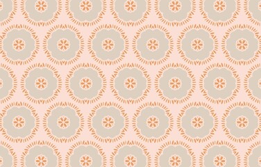 A pattern of circles and flowers is shown on a light pink background