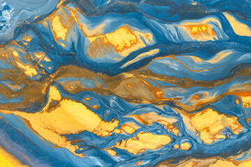 Vibrant swirling blue and gold abstract texture pattern