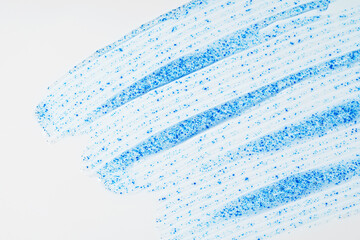 Face scrub smears highlighting micro-exfoliating particles