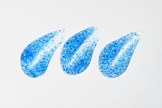 Exfoliating Face Scrub Smears with Blue Particles Texture
