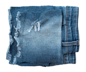 Piece of torn denim on a white background. Denim texture