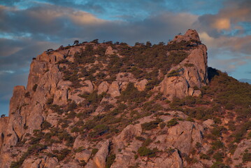 Russia, New World. Picturesque view of the cliffs illuminated by the dawn sun on the Black Sea coast from Cape Kapchik on the Crimean Peninsula.