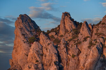 Russia, New World. Picturesque view of the cliffs illuminated by the dawn sun on the Black Sea coast from Cape Kapchik on the Crimean Peninsula.