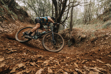Cyclist Skidding on Dirt in Action with Gravel Bike