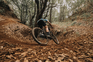 Cyclist Skidding on Dirt in Action with Gravel Bike