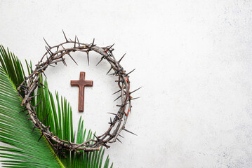 Palm Sunday. Crown of thorns, cross on palm leaf