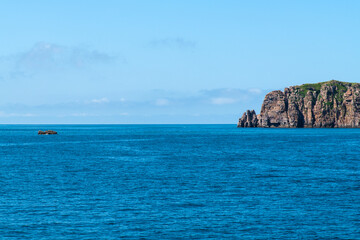 fishing boat and the cliff at the seaside