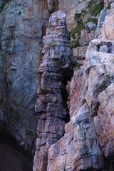 stone pillar and cliff at the seaside