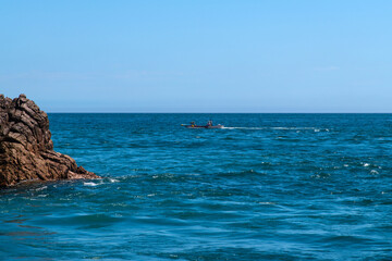 Fototapeta premium fishing boat and cliff at the seaside
