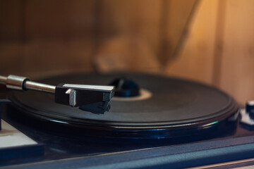 Vintage music player with vinyl and radio creates a retro atmosphere in the world of ancient music.