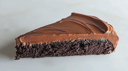 Isolated large chocolate cake slice with smooth frosting isolated on solid white background.