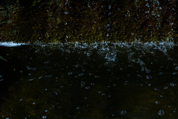 This is a close up image showing a splash of water in a body of water